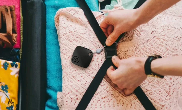 iTagPro GPS tracker attached to luggage during our travel tracking scenarios